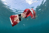Discarded plastic food packaging floating in the sea, Sulawesi, Indonesia, November 2018