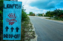Sign for Lionfish drop off. Local fisherman are paid to catch invasive lionfish (Pterois volitans) in the Caribbean to help reduce their numbers and, in turn, help the reefs. Image made on Eleuthera,...
