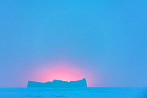 Sea ice and iceberg during polar night. Atka Bay, Antarctica. July 2017.
