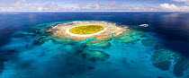 Aerial panorama of Fangasito Island in the Vava&#39;u island, Kingdom of Tonga, showing fringing coral reef structure and white sand beaches around the island.
