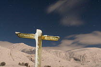 Affric Kintail Way sign post at night in winter, Glen Affric, Scotland, UK. December 2017.