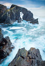 Stac a Phris sea arch with crashing waves on the west coat of the isle of Lewis, Outer hebrides, scotland, uk