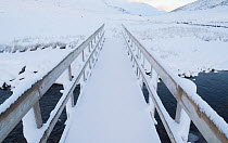 Walking the Affric Kintail Way long distance footpath in winter, River Afrric, Glen Affric, Scotland, UK, December.