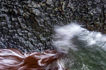 Crashing waves at large basalt wall, Arnarstapi, Snaefellsnes, Iceland. May 2013