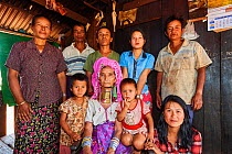 Multi-generational Kayan Lahwi family portrait. The grand mother is wearing the traditional brass neck coils and clothing, which the youger women have decided not to put on any more. The Long Neck Kay...
