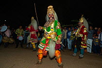 Local man performing in the Veeragase dance, where pairs of dancers perform to narration of the story of the Daksha yajnaa, Karnataka, India. January 2019.