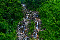 Waterfall in jungle habitat in Sun World Ba Na Hills, Danang, Vietnam.