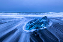 RF - Sculptured glacial ice on the black or &#39;diamond&#39; beach at Jokulsarlon Glacier Lagoon, Iceland. December 2017. (This image may be licensed either as rights managed or royalty free.)