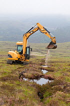 Digger creating pools on upland peat moor to retain rainwater and create wetland habitat more suitable for sphagnum moss, Alladale Estate, Sutherland, Scotland, UK., July 2012.