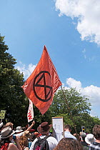 Extinction Rebellion flag flying during climate change protest. Bristol, England, UK. 16 July 2019.