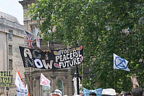 &#39;Act now for a peaceful future&#39; banner. Extinction Rebellion climate change protest march. Bristol, England, UK. 16 July 2019.