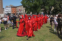 The Red Brigade performance artists at Extinction Rebellion protest rally. Bristol, England, UK. 16 July 2019.