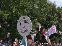 &#39;Think or swim!&#39; placard at Extinction Rebellion climate change protest. Bristol, England, UK. 16 July 2019.
