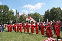 The Red Brigade performance artists at Extinction Rebellion protest rally. Bristol, England, UK. 16 July 2019.