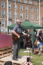Campaigner Billy Bragg singing at Extinction Rebellion rally. Bristol, England, UK. 16 July 2019.