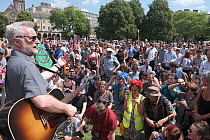 Campaigner and singer Billy Bragg addressing demonstrators at Extinction Rebellion rally. Bristol, England, UK. 16 July 2019.