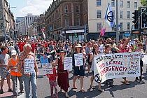 Extinction Rebellion climate change protesters marching through city centre. Bristol, England, UK. 16 July 2019.