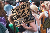 &#39;Noah won&#39;t save us, it&#39;s rebel or die&#39; placard held by protestor. Extinction Rebellion march and rally, Bristol, England, UK. 16 July 2019.