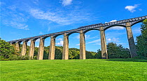 Pont-Cysyllte aqueduct over the River Dee viewed from the west side with a narrow boatcrossing in the Vale of Llangollen North Wales, UK, September.