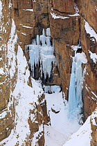 Ice waterfalls in the depth of Sudong canyon near Kibber, Spiti Valley, Cold Desert Biosphere Reserve, Himalaya, Himachal Pradesh, India, March