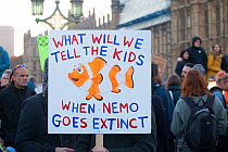 &#39;What will we tell the kids when nemo goes extinct&#39; placard at Extinction Rebellion climate change demonstration.. London, England, UK. 17 November 2019.