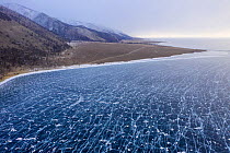 Ice with cracks on Lake Baikal, near shore, aerial shot. Photographed for The Freshwater Project extended. Near Khuzhir, Olchon Island, Irkutsk Oblast and Buryat Republic, Siberia, Russia. February 20...