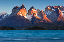 Paine Massif / Cuernos del Paine mountains above Lago Pehoe, at sunrise. Torres del Paine National Park, Patagonia, Chile. November 2015.