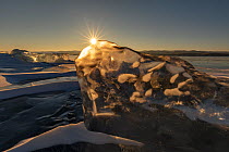 Sunrise over ice formations on Lake Baikal. Siberia, Russia. February.