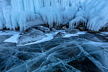 Cracks in clear ice of Lake Baikal, Siberia, Russia. February.