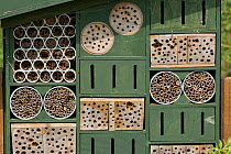 Insect / invertebrate house / bug hotel with various refuge options for hiding / over-wintering, WWT, West Sussex, UK, July.