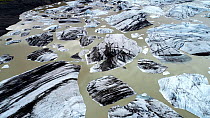 Aerial view of large pieces of calved ice in a meltlake beneath Hoffellsjokull, an outlet glacier of the Vatnajokull ice cap, Iceland, August 2018