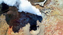 Aerial shot of steam geysers at Gunnhuver Hot Springs, Reykjanes Peninsula, Iceland, August 2018.