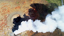 Aerial shot of steam geysers at Gunnhuver Hot Springs, Reykjanes Peninsula, Iceland, August 2018.