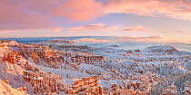 Landscape of hoodoos in snow at sunrise, Bryce Canyon National Park, Utah, USA, January.