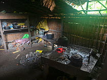 Kitchen area inside traditional thatched house. Nara village, Makira Island, Solomon Islands. 2018.