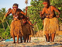 Women performing traditional dance on beach. Savo Island, Solomon Islands.
