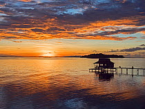 Sunrise over island of Kolombangara. Viewed from Fatboys, Babanga Island, New Georgia Islands, Solomon Islands. 2018.
