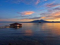Kolombangara Island at dawn, viewed across sea from Fatboys, Babanga Island, New Georgia Islands, Solomon Islands. 2018.