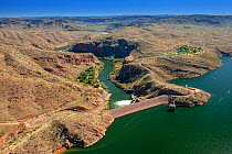 Lake Argyle reservoir dam wall and outflow, aerial view. Reservoir dammed in 1971 for Ord River Irrigation Scheme. The Kimberley, Western Australia. 2017.