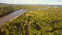 Aerial shot panning over the Rio Napo, looking towards the village of Misahualli, Amazon rainforest, Napo Province, Ecuador, 2017. (non-ex)