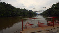 Timelapse of a cable ferry crossing the Nangaritza River, seen from the deck of the ferry, Zamora Chinchipe Province, Ecuador, 2018. (non-ex)