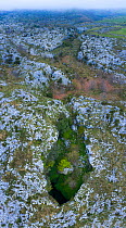 Mortero de Astrana, karst landscape with cave, aerial view. Astrana, Alto Ason, Soba Valley, Cantabria, Spain. April 2019.
