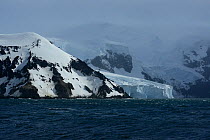 Glacier meeting Southern ocean on coast of Buckle Island, Balleny Islands, East Antarctica. January 2018.