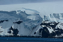 Glacier studded coastline, east coast of Buckle Island, Balleny Islands, Antarctica. January 2018.