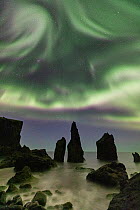 Aurora borealis above  sea stacks, Reykjanes Peninsula, Iceland. 2019.