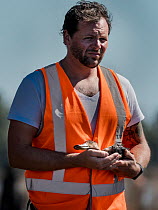 Animal welfare advocate, wildlife rescuer, fireman and vegan chef David Knightingale rescuing a duck that has just been shot at the opening of Victoria&#39;s Duck Hunting Season. March 2018. Kerang we...