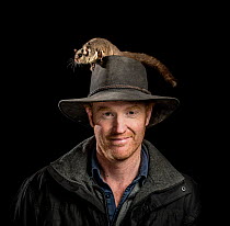 Co-founder of the Conservation Ecology Centre in the Otways Shane Neal with his captive Sugar Gliders (Petaurus breviceps). July 2018, Conservation Ecology Centre, the Otways, Victoria, Australia.  Ed...