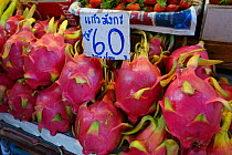 Dragon fruit (Hylocereus undatus) on stall at food market, Bangkok, Thailand. 2015.