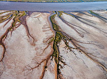 Patterns in the tidal  flats of the Colorado River Delta where the delta is swept by tidal encroachment from the Gulf of California. Receding tide causes  waterfalls approximately eight feet high, as...