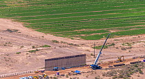 Aerial view of construction of the controversial southern border wall between Arizona and Sonora, Mexico. This is being converted from a ten foot wall to a thirty foot high barrier in accordance with...